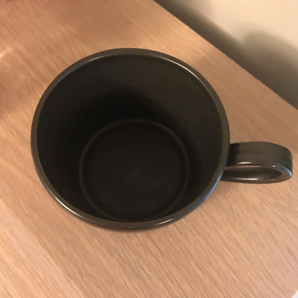 Black Anthropologie iridescent ceramic tea cup
